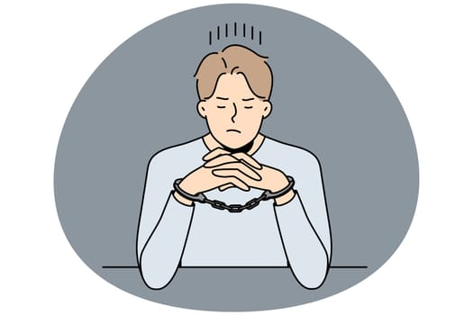 Unhappy young man in handcuffs sit at desk in interrogation room. Stressed male criminal or thief in cuffs wait in jail cell or prison. Vector illustration.
