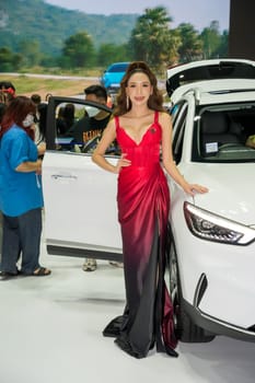 Nonthaburi, Thailand - APR 2, 2023 Unidentified model poses with a car at The 44th Bangkok international motor show 2023 at IMPACT Arena, Muang Thong Thani, Nonthaburi, Thailand.