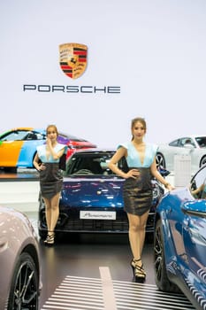 Nonthaburi, Thailand - APR 2, 2023 Unidentified model poses with a car at The 44th Bangkok international motor show 2023 at IMPACT Arena, Muang Thong Thani, Nonthaburi, Thailand.