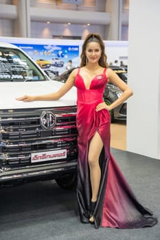 Nonthaburi, Thailand - APR 2, 2023 Unidentified model poses with a car at The 44th Bangkok international motor show 2023 at IMPACT Arena, Muang Thong Thani, Nonthaburi, Thailand.