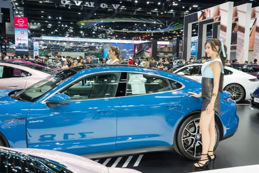 Nonthaburi, Thailand - APR 2, 2023 Unidentified model poses with a car at The 44th Bangkok international motor show 2023 at IMPACT Arena, Muang Thong Thani, Nonthaburi, Thailand.