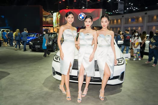 Nonthaburi, Thailand - APR 2, 2023 Unidentified model poses with a car at The 44th Bangkok international motor show 2023 at IMPACT Arena, Muang Thong Thani, Nonthaburi, Thailand.