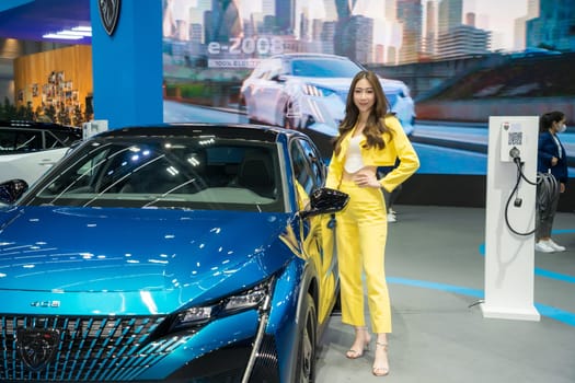 Nonthaburi, Thailand - APR 2, 2023 Unidentified model poses with a car at The 44th Bangkok international motor show 2023 at IMPACT Arena, Muang Thong Thani, Nonthaburi, Thailand.