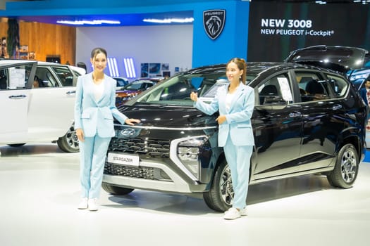 Nonthaburi, Thailand - APR 2, 2023 Unidentified model poses with a car at The 44th Bangkok international motor show 2023 at IMPACT Arena, Muang Thong Thani, Nonthaburi, Thailand.