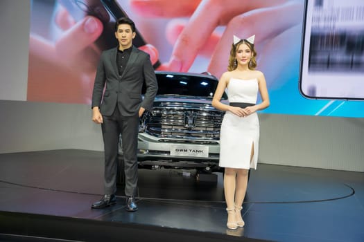 Nonthaburi, Thailand - APR 2, 2023 Unidentified model poses with a car at The 44th Bangkok international motor show 2023 at IMPACT Arena, Muang Thong Thani, Nonthaburi, Thailand.