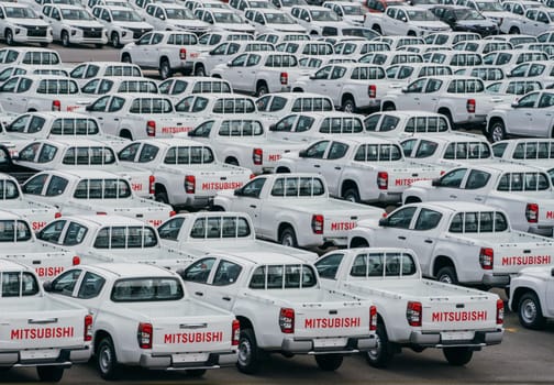 Lamchabang, Thailand - July 02, 2023 the car factory, the distribution center is full of brand new cars. top view reveals the crowded parking, epitomizing modern manufacturing and business.