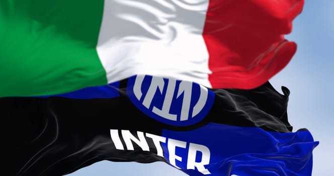 MIlan, IT, Sept. 10 2023: Flags of Inter football club and Italy waving in the wind on a clear day. Illustrative editorial 3d illustration render. Fluttering fabric