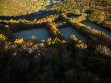 Forest and hills landscape at sunrise in  wintertime in Aveyron France