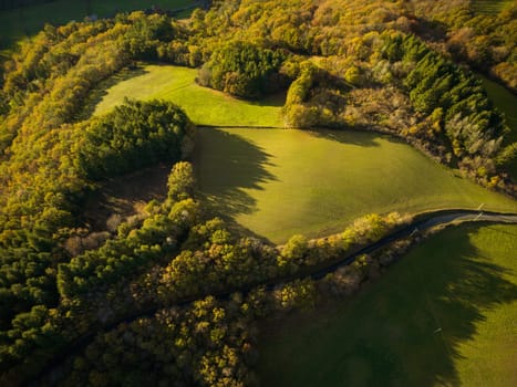 Forest and hills landscape at sunrise in  wintertime in Aveyron France