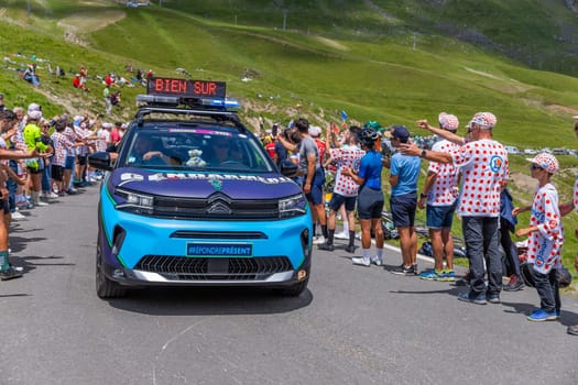 Col du Tourmalet, France - July 06 2023: Caravan car at the top of the Col du Tourmalet in Pyerenees mountains during the stage 6 of Le Tour de France 2023