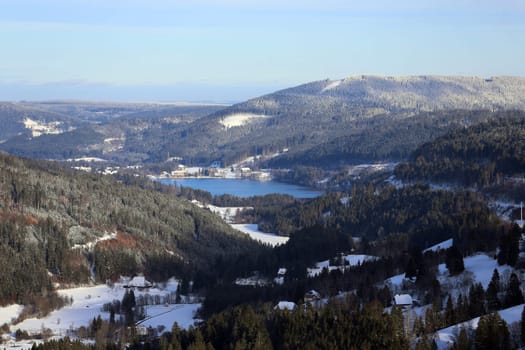 View from the Feldberg Pass over the snow-covered Bear Valley to Lake Titisee  First onset of winter in Germany.   In the Upper Black Forest,as here on the Feldberg (Breisgau-Hochschwarzwald district),there were the first heavy snowfalls on Tuesday with the cold air and temperatures below freezing point - on Wednesday the landscape presented itself in its best white winter dress. Sugar-covered fir trees with a snow depth of a good 40 centimetres,sunshine attracted the first winter sports enthusiasts to the highest elevation in the country. On the first weekend in December,the winter sports season on the Feldberg is to be opened.