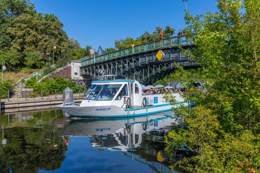 Berlin, Germany: August 11, 2023: Boat with tourists under the Bridge over the Landwehr Canal, Tiergarten, Berlin