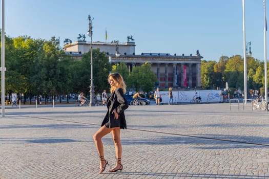 Berlin, Germany - May 30, 2023: Beautiful woman posing with near The Berliner Dom, or Cathedral of Berlin, Berlin, Germany