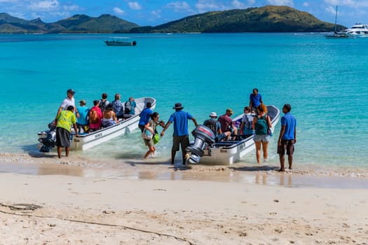 Nacula, Fiji: 26 May 2023: Tourists at the tropical sandy beach of Nacula island, Yasawa islands, Fiji, South Pacific Islands, Pacific