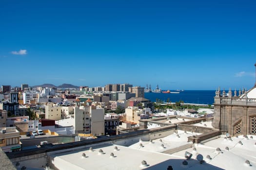 Panoramic view from above of the capital Las Palmas Gran Canaria in Spain with part of the Santa Ana Cathedral and views to the harbor and the sea