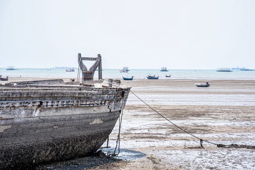 The remains of a fishing boat left on the beach.