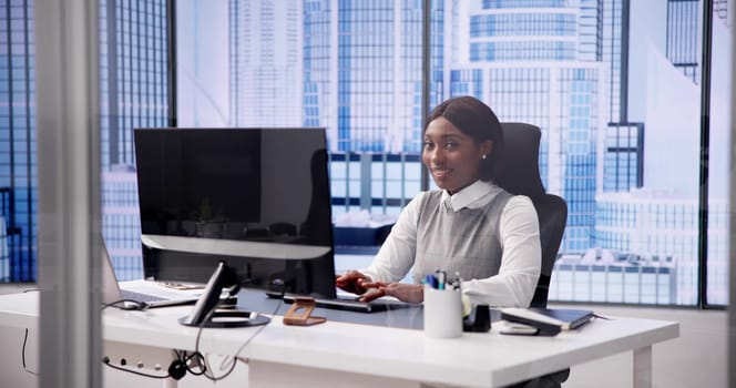 African woman using computer for business communication