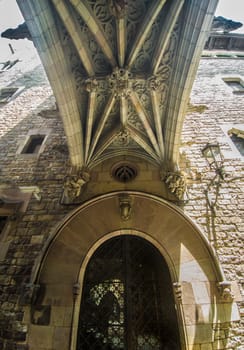 Under the bridge at Bisbe street in Barri Gotic, Barcelona. Spain