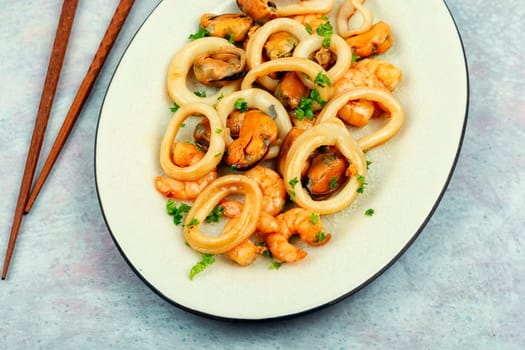 Roasted mussels, squid and shrimp. Seafood plate
