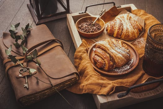 Cinnamon rolls or Franzbroetchen -  Germany sweet pastry sweet pastry baked with butter and cinnamon,  croissant with cocoa chips