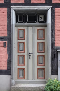 A detailed  picture of a restored, ornately decorated old front door