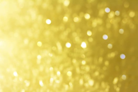 Christmas golden background with glittering snowflakes