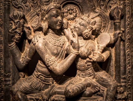 Turin, Italy - April, 2023: Oriental Art Museum. Shiva and Parvati, 10th Century A.D. For Hinduism religion the couple is symbol of love and devotion - traditional practice of sex, tantra and kamasutra