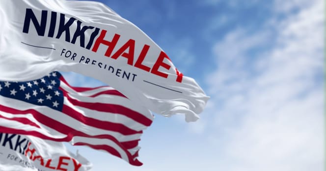 Washington D.C., US, June 15 2023: Nikki Haley election campaign and the american flags waving on a clear day. Illustrative editorial 3d illustration render. 2024 United States presidential election