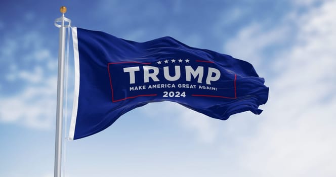 Arlington, US, OCT. 21 2023: Donald Trump election campaign flag waving on a clear day. 2024 US presidential election. Illustrative editorial 3d illustration render