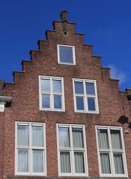 Beautiful old house with stepped gables, built of red brick stones