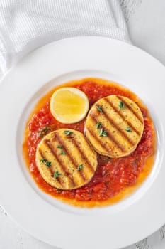 Portion of grilled cheese with tomato basil sauce