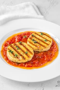 Portion of grilled cheese with tomato basil sauce