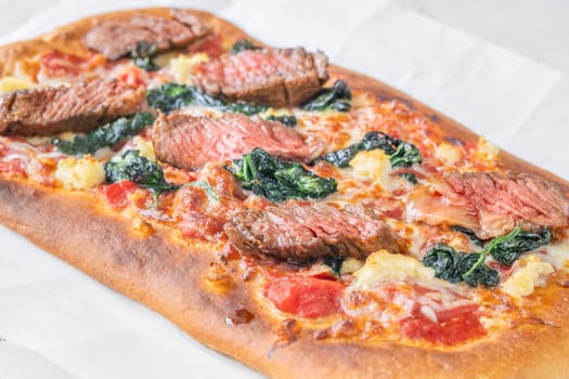 Beef steak focaccia with spinach and cheese