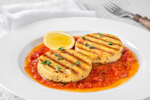 Portion of grilled cheese with tomato basil sauce