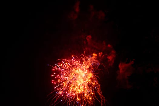 Big colorful fireworks in the black night sky