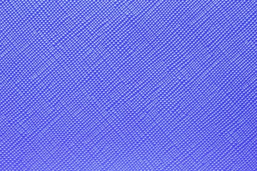 Seamless plastic texture background. Close-up of a detail from a blue surface of a cosmetic bag. Beautiful backdrop. Macro.