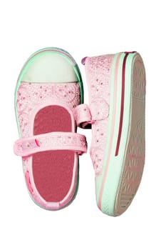 Child shoes fashion. Close-up of a pair light pink shoes or sneaker for girls with pearls and hearts isolated on a white background. Elegant and trendy shoe fashion for kids. Macro.