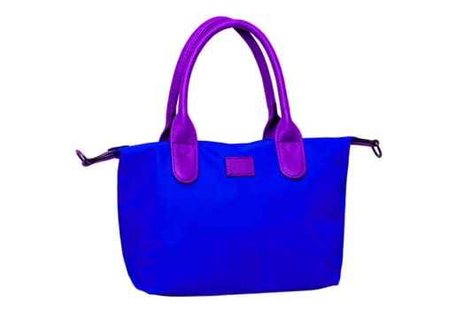Stylish women's handbag. A fashionable female blue luxury handbag with brown leather handles isolated on white. Clipping path. Fashionable womans accessories. Advertising.