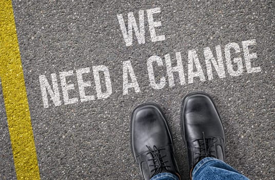 Text on the road - We need a change