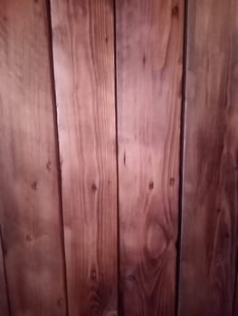 wood texture background in brown red color. High quality photo. Can used for texture backdrop, background for floor goods, wallpapers, long vertical planks.