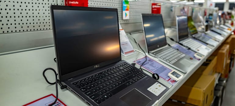 POZNAN, POL - DEC 8, 2023: Laptop computers put up for sale in a store.