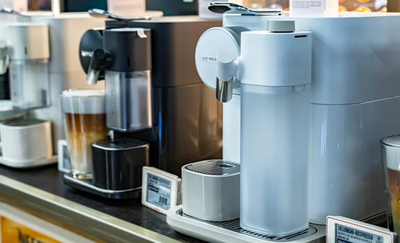POZNAN, POL - DEC 8, 2023: Nespresso coffee makers put up for sale in a store.
