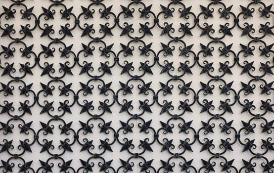 Detail of an ancient window with grating in wrought iron. Venice, Italy,