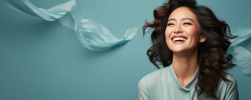 cheerful asian young woman with a smile presenting an idea while standing alone on a color background. banner for beauty salons