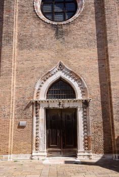 Ornate doorway and facade of the church of San Gregorio, Venice, Italy