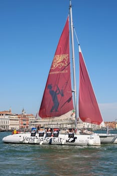 Venice, Italy - September 5, 2022: Catamaran sailing along the San Marco Canal in Venice, Italy