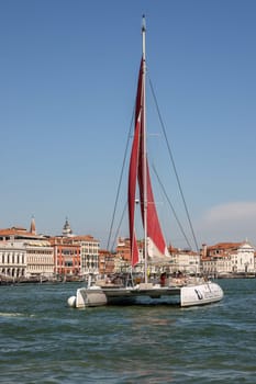 Venice, Italy - September 5, 2022: Catamaran sailing along the San Marco Canal in Venice, Italy