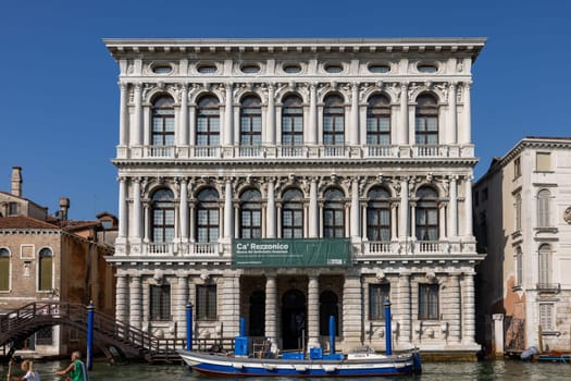 Venice, Italy - September 6, 2022: The white marble facade of Ca' Rezzonico on the Grand Canal in Venice. Italy