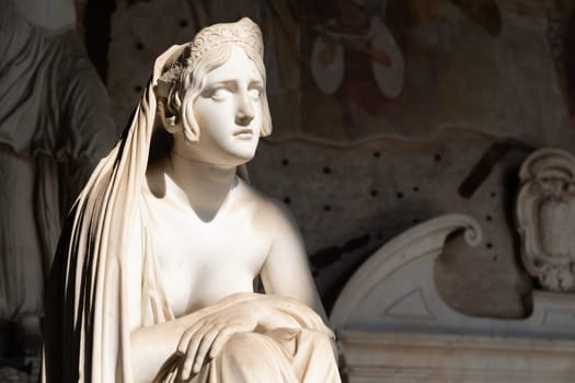 Pisa, Italy - June 2023: catholic cemetery, antique statue of sad woman, by Lorenzo Bartolini, 1841