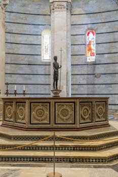 Pisa, Italy - 29 June 2023: Baptistery interior, basilica altar, catholic church. Italy travel destination.